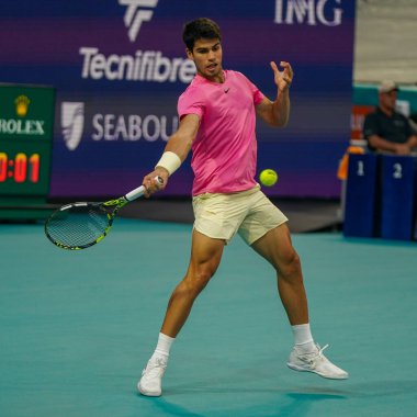 MIAMI GARDENS, FLORIDA - MARCH 30, 2023: Carlos Alcaraz of Spain in action during quarter-final match against Taylor Fritz of United States at 2023 Miami Open at the Hard Rock Stadium in Miami Gardens clipart