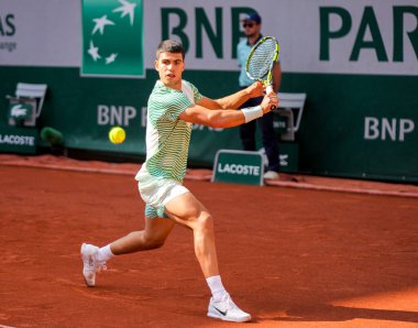 PARIS, FRANCE - MAY 29, 2023: Professional tennis player Carlos Alcaraz of Spain in action during men singles first round match against Flavio Cobolli of Italy at 2023 Roland Garros in Paris, France clipart