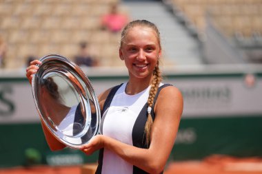 PARIS, FRANCE - JUNE 10, 2023: 2023 Roland Garros Girls' singles Champion Alina Korneeva of Russia posing with trophy after final match against Lucciana Perez Alarcon of Peru at Stade Roland Garros clipart