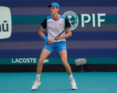 MIAMI GARDENS, FLORIDA - MARCH 31, 2024: Jannik Sinner of Italy in action during men's singles final match against Grigor Dimitrov of Bulgaria at 2024 Miami Open at the Hard Rock Stadium in Miami Gardens clipart