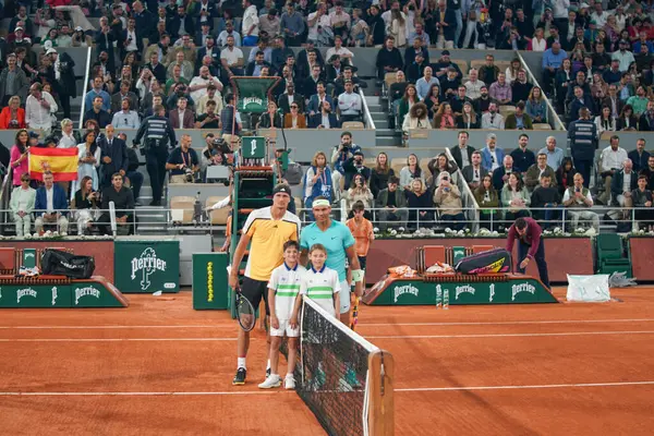 stock image PARIS, FRANCE - MAY 27, 2024: Grand Slam champion Rafael Nadal of Spain (R) and Alexander Zverev of Germany by the net before 2024 Roland Garros first round match at Court Philippe Chatrier in Paris, France