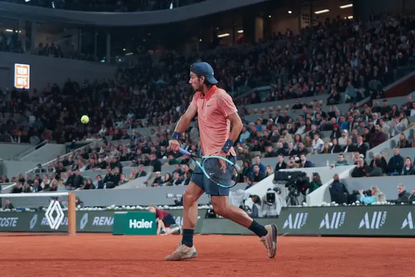 stock image PARIS, FRANCE - MAY 30, 2024: Professional tennis player Lorenzo Musetti of Italy in action during his 2024 Roland Garros second round match against Gael Monfils of France at Court Philippe Chatrier