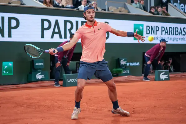 stock image PARIS, FRANCE - MAY 30, 2024: Professional tennis player Lorenzo Musetti of Italy in action during his 2024 Roland Garros second round match against Gael Monfils of France at Court Philippe Chatrier