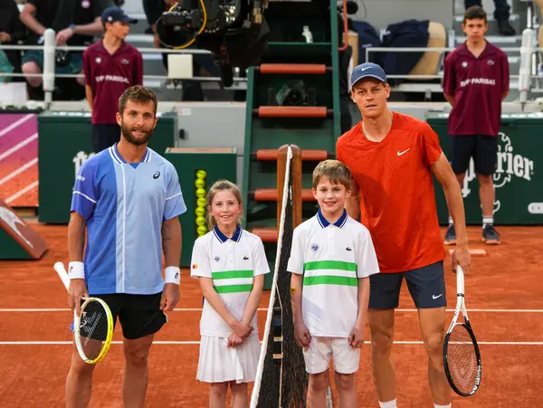 stock image PARIS, FRANCE - JUNE 2, 2024: Corentin Moutet of France (L) and Grand Slam champion Jannik Sinner of Italy by the net before 2024 Roland Garros men's fourth round match in Paris, France