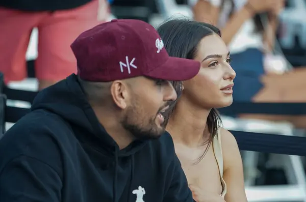 stock image NEW YORK - AUGUST 22, 2024: Professional tennis player Nick Kyrgios and his girlfriend Costeen Hatzi attend tennis match during 2024 Ultimate Tennis Showdown New York Day 1 at Forest Hills Stadium in Queens, New York