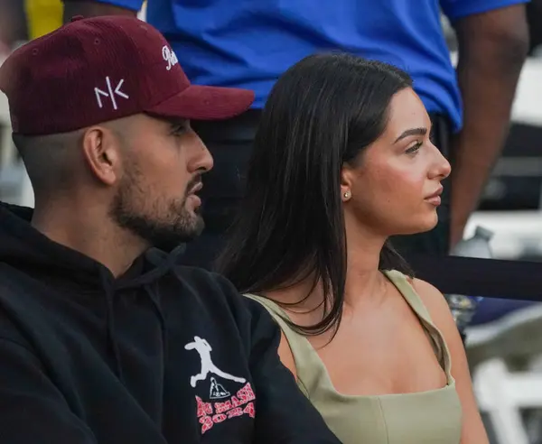 stock image NEW YORK - AUGUST 22, 2024: Professional tennis player Nick Kyrgios and his girlfriend Costeen Hatzi attend tennis match during 2024 Ultimate Tennis Showdown New York Day 1 at Forest Hills Stadium in Queens, New York