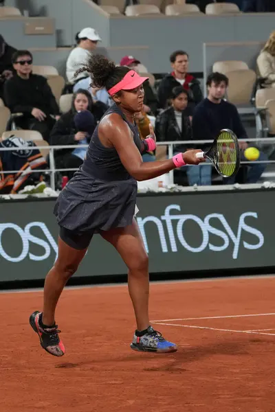 stock image PARIS, FRANCE - MAY 29, 2024: Grand Slam Champion Naomi Osaka of Japan in action during her 2024 Roland Garros second round match against Iga Swiatek of Poland at Court Philippe Chatrier in Paris, France