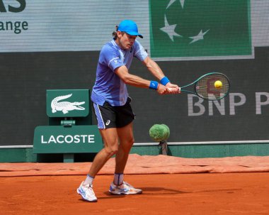 PARIS, FRANCE - JUNE 3, 2024: Alex de Minaur of Australia in action during 2024 Roland Garros men's fourth round match against Grand Slam champion Daniil Medvedev of Russia in Paris, France clipart