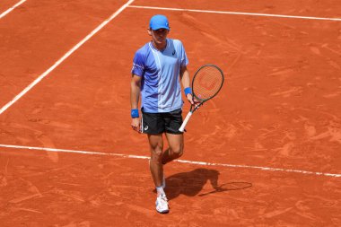 PARIS, FRANCE - JUNE 3, 2024: Alex de Minaur of Australia in action during 2024 Roland Garros men's fourth round match against Grand Slam champion Daniil Medvedev of Russia in Paris, France clipart