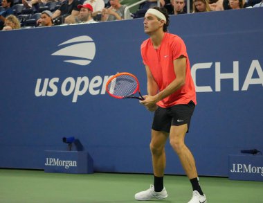 NEW YORK - SEPTEMBER 3, 2023: Professional tennis player Taylor Fritz of United States in action during 2023 US Open round of 16 match against Dominic Stricker of Switzerland at the Louis Armstrong Stadium clipart