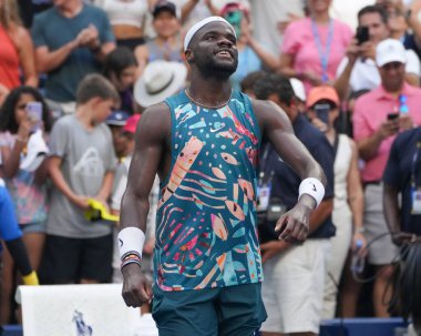 NEW YORK - SEPTEMBER 3, 2023: Professional tennis player Frances Tiafoe of United States celebrates victory after his 2023 US Open round of 16 match against Rinky Hijikata of Australia at the Louis Armstrong Stadium clipart