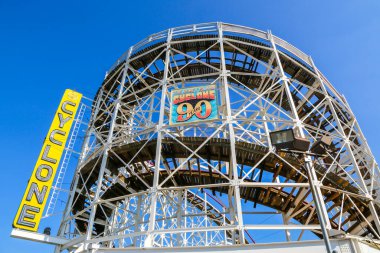 BROOKLYN, NEW YORK - AUGUST 19, 2017: Historical landmark Cyclone roller coaster in the Coney Island section of Brooklyn. Cyclone is a historic wooden roller coaster opened on June 26, 1927 clipart