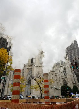 NEW YORK - NOVEMBER 11, 2021: Con Edison steam stacks in Midtown Manhattan. The New York City steam system include Con Edison's Steam Operations, which provides steam to large parts of Manhattan clipart