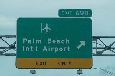 WEST PALM BEACH, FLORIDA - JUNE 2, 2021: Exit 69B, Palm Beach International Airport, Interstate I-95, Southbound, Florida  clipart