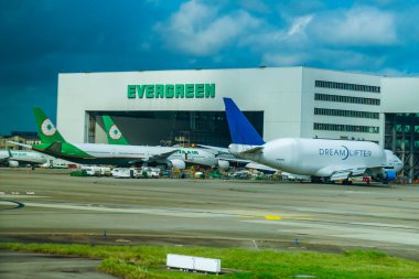 TAOYUAN CITY, TAIWAN - SEPTEMBER 28, 2024:  Boeing 747 Dreamlifter, one of the worlds largest cargo freighters, on tarmac at Taoyuan International Airport, Taiwan.  clipart