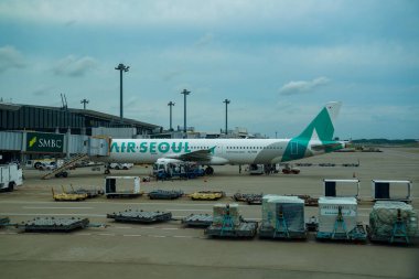 NARITA, JAPAN - SEPTEMBER 29, 2024: Air Seoul Airbus A321 on tarmac at Tokyo-Narita International Airport in Japan. Air Seoul is a South Korean low-cost carrier and a subsidiary of Asiana Airlines clipart