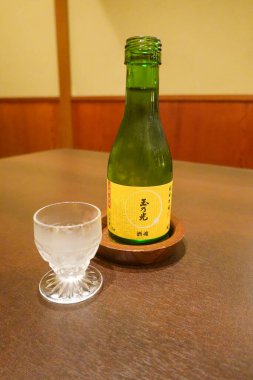 KYOTO, JAPAN - OCTOBER 8, 2024: Traditional bottle of sake served in Kyoto, Japan  clipart