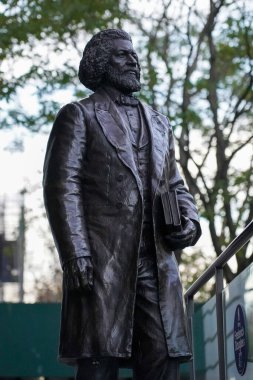 NEW YORK - DECEMBER 4, 2021: Frederick Douglass statue on the steps of New York Historical Society building, at the W 77th Street entrance. The New York Historical museum is the oldest in New York City clipart