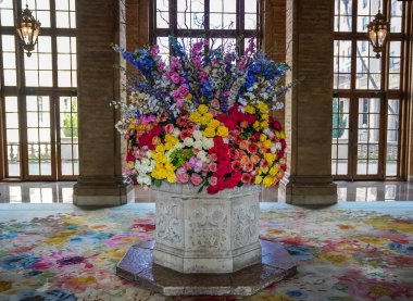 Festive florals welcome guests at The Breakers Palm Beach in Florida. The Breakers Palm Beach is a historic, 538 room, Italian Renaissance-style hotel in Palm Beach, Florida clipart