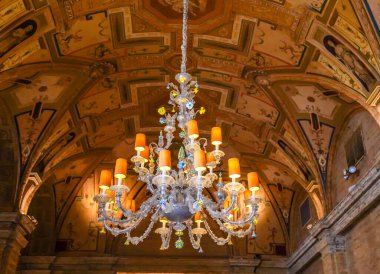 PALM BEACH, FLORIDA - NOVEMBER 16, 2024: The crystal chandelier in the lobby at The Beakers Palm Beach hotel. The Breakers Palm Beach is a historic, 538 room, Italian Renaissance-style hotel in Palm Beach, Florida clipart