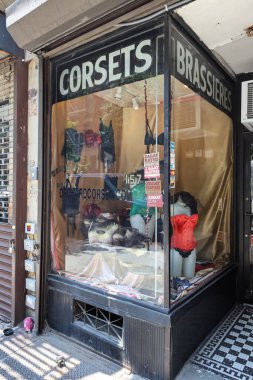 NEW YORK - JULY 30, 2019: Storefront view of a clothing store on Delancey Street in New York. Delancey Street has long been known for its discount and bargain clothing stores clipart