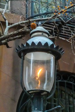 Vintage gas lamp in the front of New York City brownstone  clipart