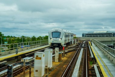 NEW YORK - JUNE 18, 2020: AirTrain in JFK Airport . AirTrain JFK is a 3-line, 8.1 miles long elevated railway providing service to Kennedy International Airport in New York clipart