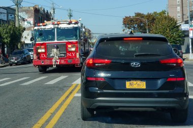 BROOKLYN, NEW YORK - OCTOBER 22, 2024: FDNY Ladder Company 157 at Flatbush Avenue in Brooklyn, New York. FDNY is the largest combined Fire and EMS provider in the world  clipart