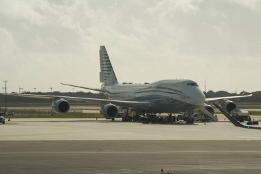 WEST PALM BEACH, FLORIDA - FEBRUARY 16, 2024: Boeing 747 formerly owned by Qatar's royal family on tarmac at Palm Beach International Airport. US President Donald Trump toured plane on February 15, 2025. clipart