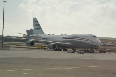 WEST PALM BEACH, FLORIDA - FEBRUARY 16, 2025: Boeing 747 formerly owned by Qatar's royal family on tarmac at Palm Beach International Airport. US President Donald Trump toured plane on February 15, 2025. clipart