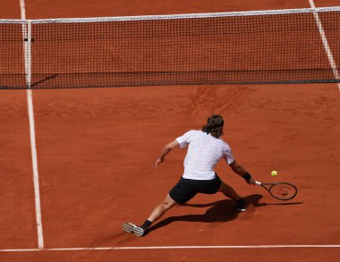 PARIS, FRANCE - MAY 30, 2022: Professional tennis player Stefanos Tsitsipas of Greece in action during his round 4 match against Holger Rune of Denmark at 2022 Roland Garros in Paris, France