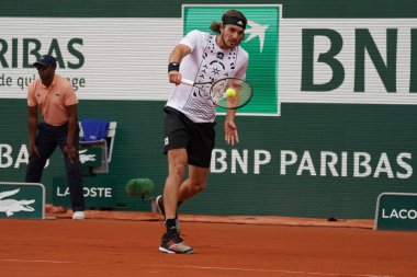 PARIS, FRANCE - MAY 30, 2022: Professional tennis player Stefanos Tsitsipas of Greece in action during his round 4 match against Holger Rune of Denmark at 2022 Roland Garros in Paris, France