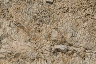 Kaya oluşumu. Taş parçalarının arka planı. Dağlar, makro fotoğrafçılık.