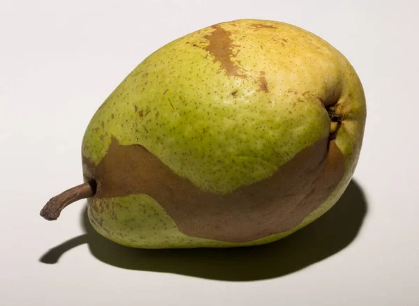 Green Pear White Background Pigmentation Fruit Conceptual Association Vitiligo — Zdjęcie stockowe