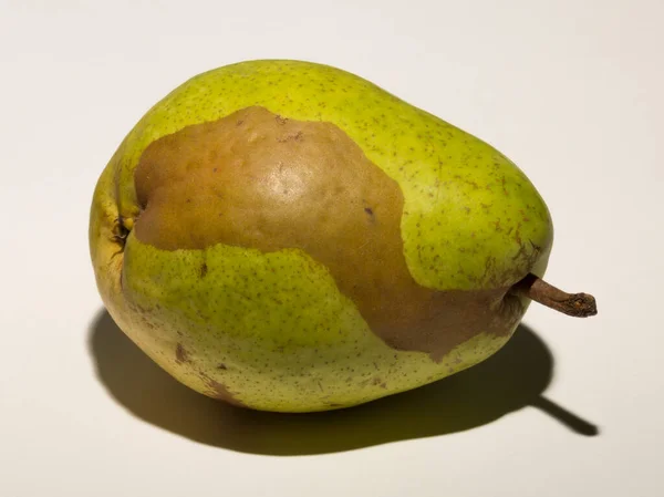 Green Pear White Background Pigmentation Fruit Conceptual Association Vitiligo — Zdjęcie stockowe