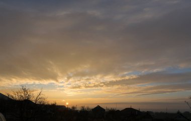 Landscape at sunset. Tragic gloomy sky. Panorama. Crimson twilight.