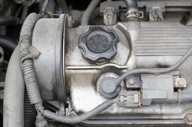 dirty engine room of an old car