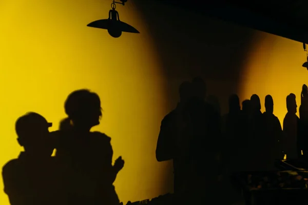 stock image shadows of people party queue in a dark hall of a nightclu