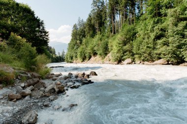mountain transparent river of white color in the gorges ecology of the plane