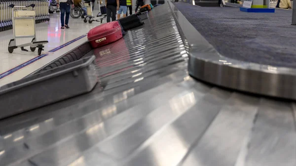 Suitcase or luggage with conveyor belt in the international airport. Luggage on the belt in the airport