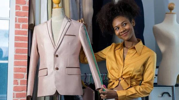 Fashion designer woman works at tailor shop. Fashion Design Mannequin Measurement Concept