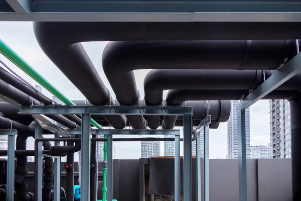 Pipe of air conditioner system on roof. a lot of pipe for air conditioner system. Industrial air conditioning tubes. Ventilation system and pipe systems installed on industrial building.