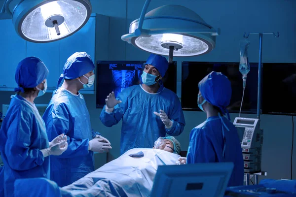 Team of surgeons is fighting for life. The doctor is undergoing surgery to save a life from an accident. Concepts of surgery and emergency accident. Emergency and serious accident.