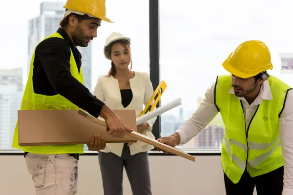 Team Engineers with draft plan of building on constructing site. Engineer work on site. engineer visit and inspection site engineer. Inspector engineer check and working on site.