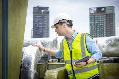 Industrial engineer work on site. engineer visit and inspection site engineer at industrial site. Inspector engineer check and working on site