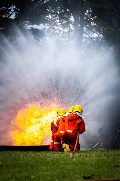 Firefighter Concept Fireman Using Water Extinguisher Fighting Fire Flame Firefighters —  Fotos de Stock