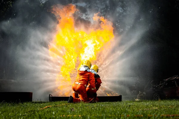 Firefighter Concept Fireman Using Water Extinguisher Fighting Fire Flame Firefighters — 图库照片