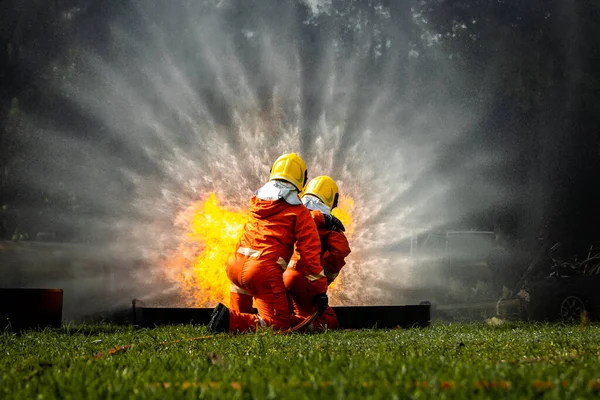 Firefighter Concept Fireman Using Water Extinguisher Fighting Fire Flame Firefighters — 스톡 사진