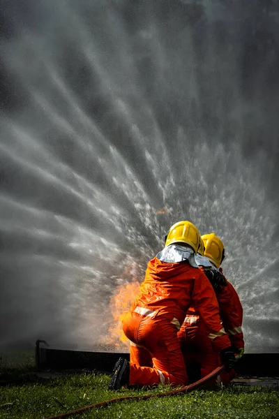 Firefighter Concept Fireman Using Water Extinguisher Fighting Fire Flame Firefighters — Φωτογραφία Αρχείου