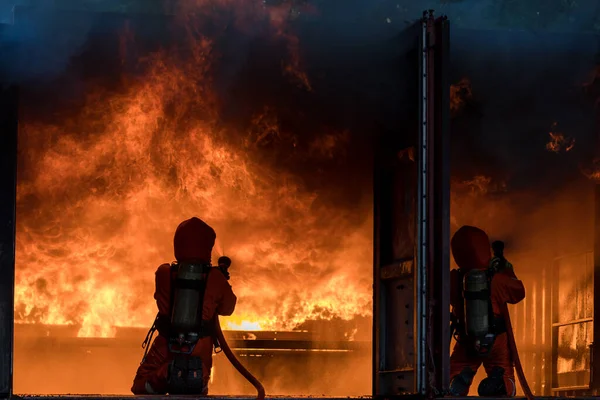 Firefighter Concept Fireman Using Water Extinguisher Fighting Fire Flame Firefighters — 스톡 사진